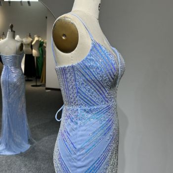  wearing a light blue sequined and beaded gown