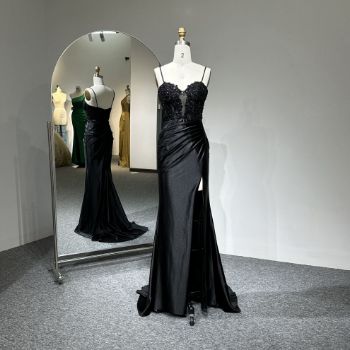 An extremely elegant, sexy, and luxurious evening gown, entirely in solid black.