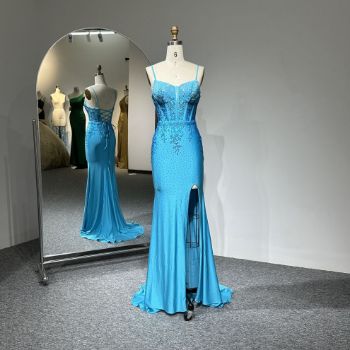 A meticulously designed blue mermaid evening gown that highlights feminine elegance and opulence.