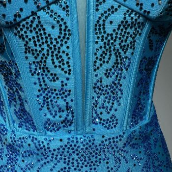 The symmetrical embroidery design looks particularly refined.