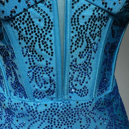 The symmetrical embroidery design looks particularly refined.