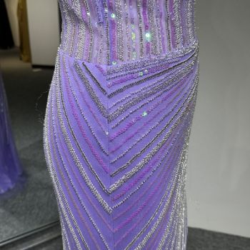 ​​The silhouette / shape at the side from the waist to the hips in this dress/gown. - ​​this double-strap, high-slit evening gown in cool-toned lilac