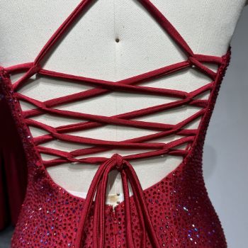 the red evening dress with ​​adjustable cross-back strap detailing